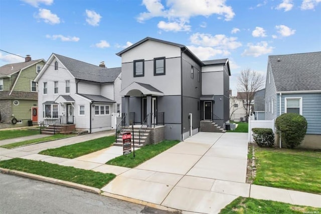 view of property with a front lawn