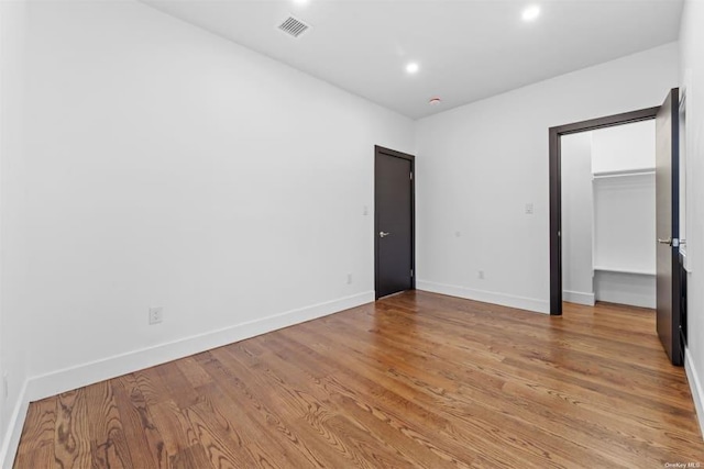 unfurnished bedroom featuring hardwood / wood-style floors