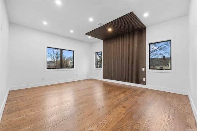 empty room with light hardwood / wood-style floors