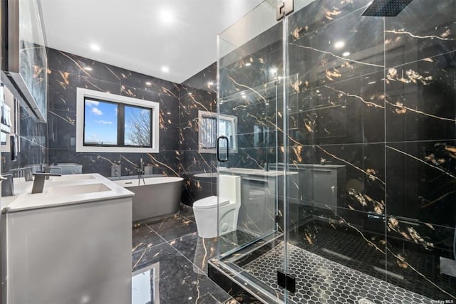 full bathroom featuring independent shower and bath, vanity, and tile walls