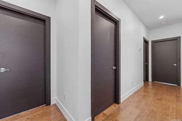 hallway with light wood-type flooring