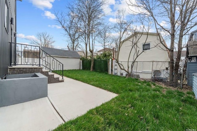 view of yard featuring an outdoor structure and a patio area