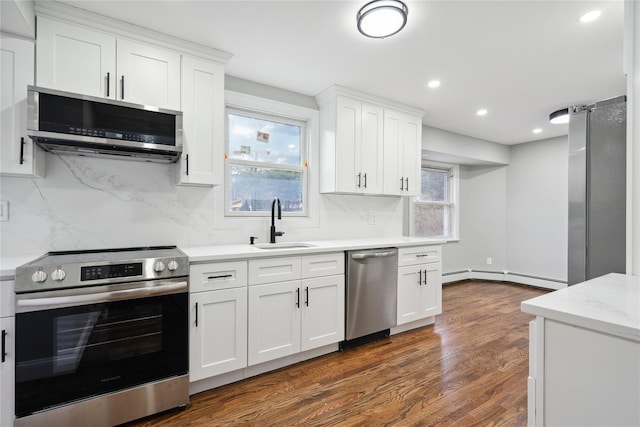 kitchen with stainless steel appliances and white cabinets