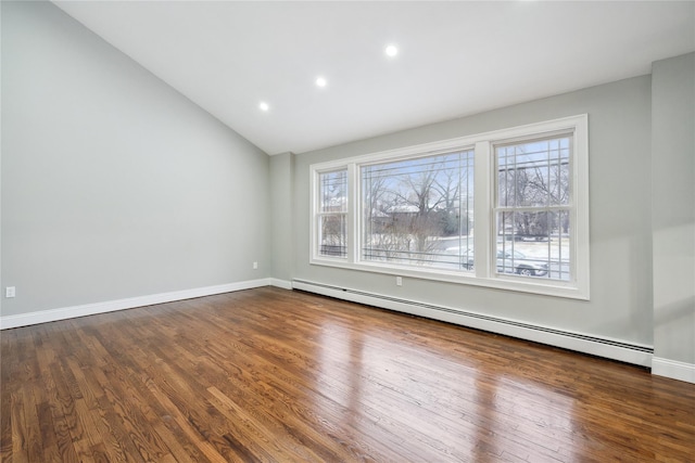 unfurnished room with plenty of natural light, dark wood-type flooring, and baseboard heating