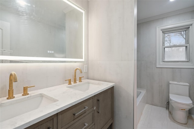 bathroom featuring vanity, ornamental molding, and toilet