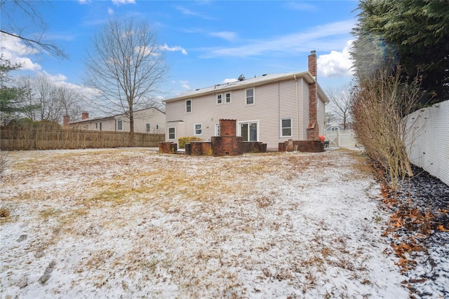 view of snow covered house