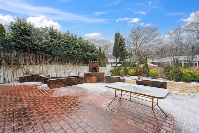 view of patio featuring an outdoor fireplace