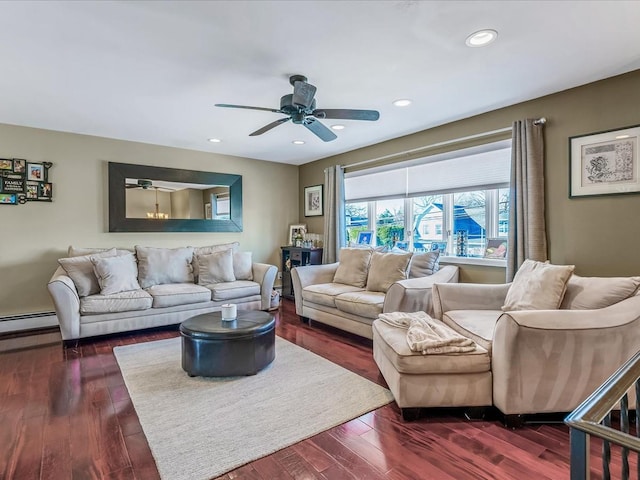 living room featuring dark wood-type flooring, ceiling fan, and baseboard heating