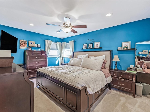 carpeted bedroom featuring ceiling fan