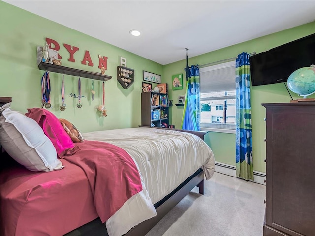 carpeted bedroom with baseboard heating