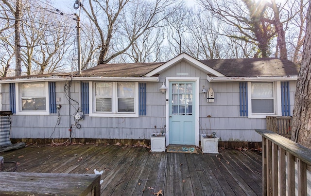 view of front of property with a wooden deck