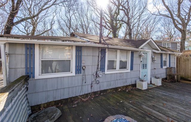 view of side of property featuring a deck