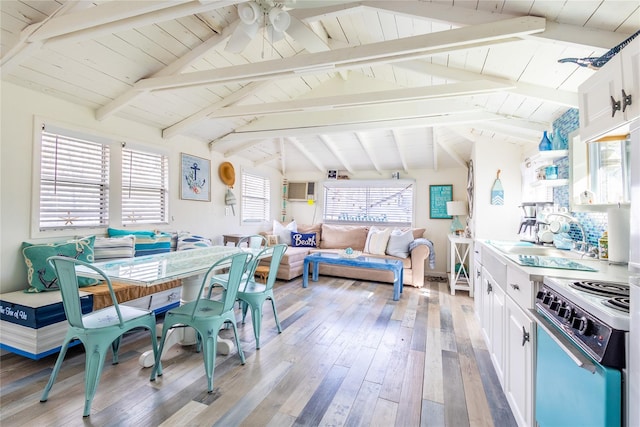 dining room featuring ceiling fan, vaulted ceiling with beams, wooden ceiling, and light wood-type flooring