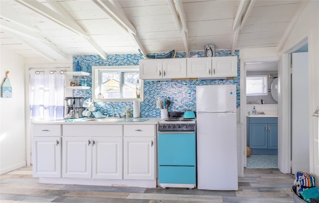 47 Woodcliff Trl, Baiting Hollow, NY 11933 - kitchen featuring sink, white appliances, white cabinets, and backsplash