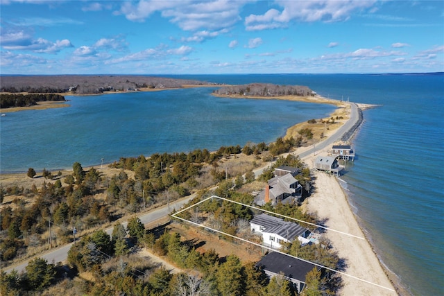 drone / aerial view with a water view and a beach view