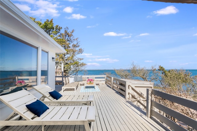 wooden deck with a water view