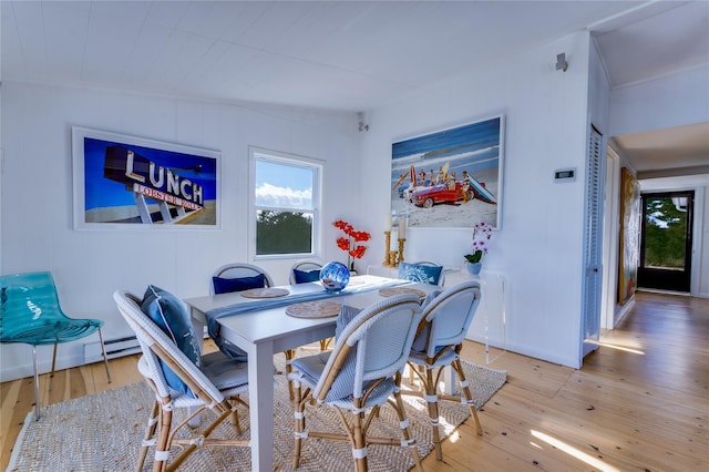 dining space featuring light wood finished floors