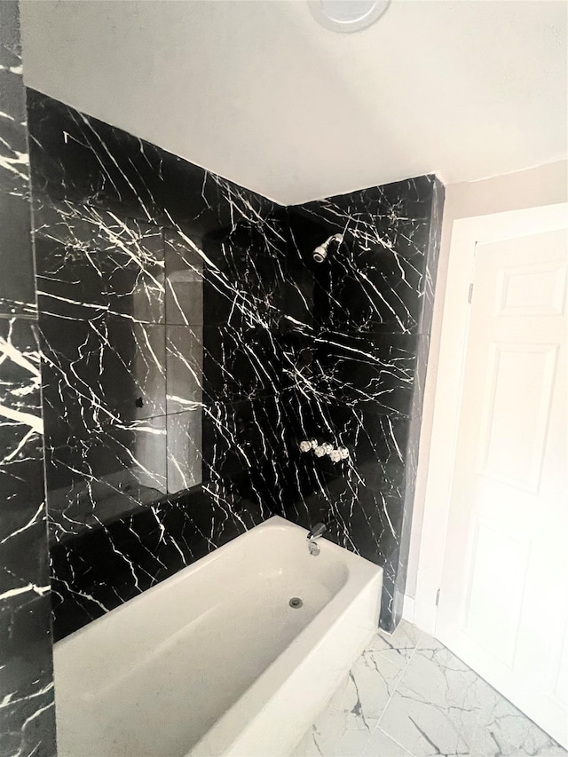 bathroom featuring marble finish floor