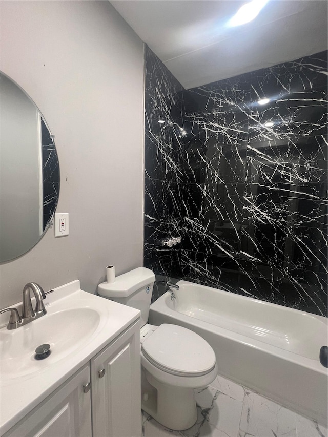 full bathroom featuring tub / shower combination, toilet, marble finish floor, and vanity