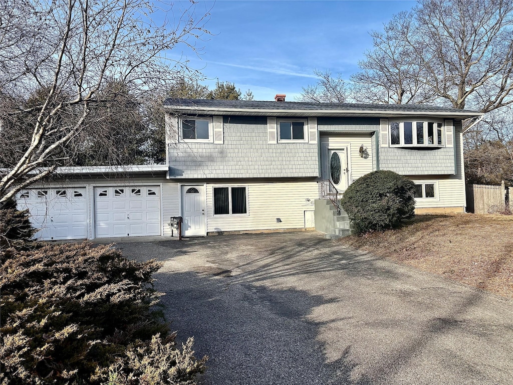 raised ranch featuring a garage