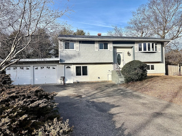 raised ranch featuring a garage