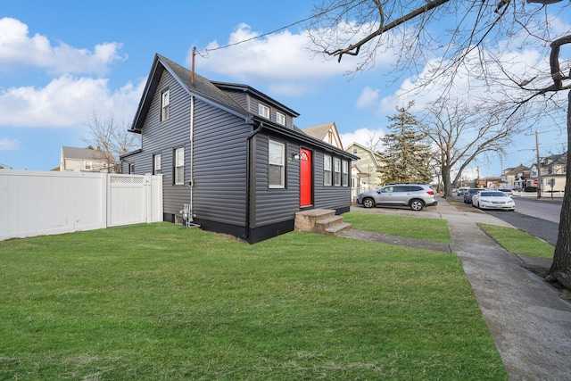 view of home's exterior with a yard