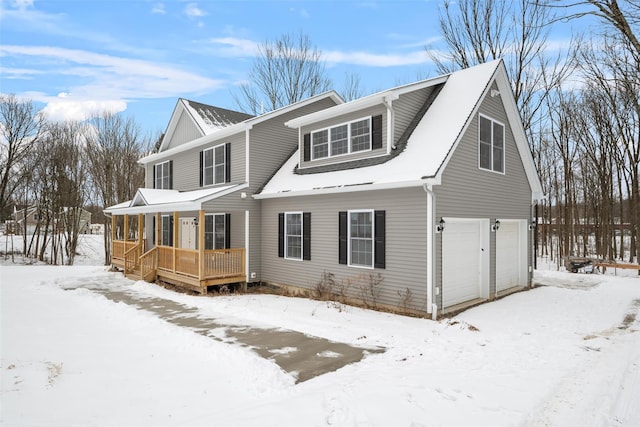 view of front facade featuring a porch and a garage