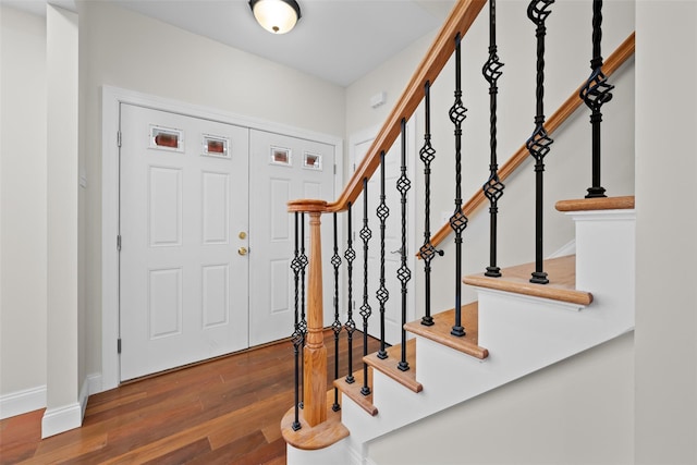 entryway with dark hardwood / wood-style floors