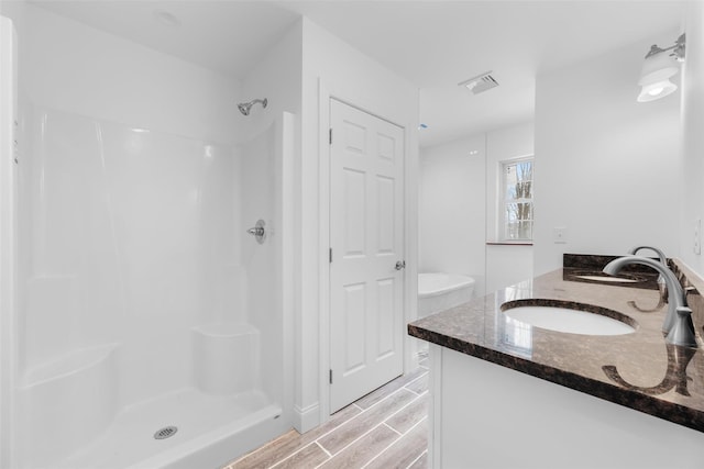 bathroom with vanity and walk in shower