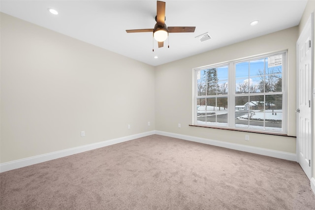 carpeted empty room with ceiling fan