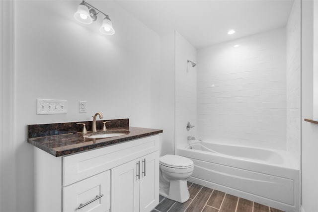 full bathroom with vanity, toilet, and tiled shower / bath