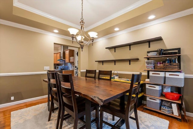 6 W Causeway, Cortlandt Manor, NY 10567 - dining space with crown molding, baseboards, wood finished floors, and a notable chandelier