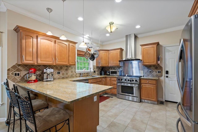 6 W Causeway, Cortlandt Manor, NY 10567 - kitchen featuring pendant lighting, a peninsula, a breakfast bar, wall chimney range hood, and stainless steel appliances