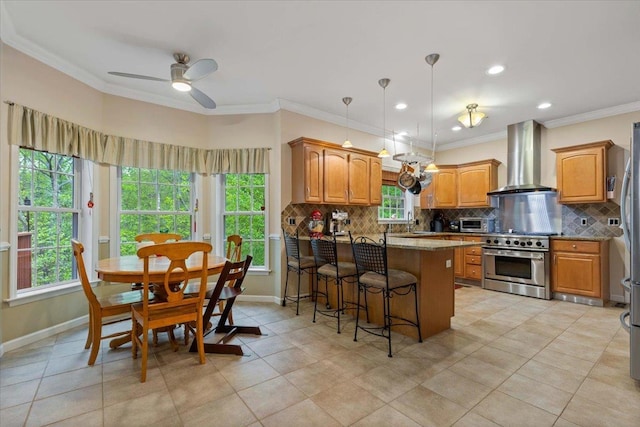 6 W Causeway, Cortlandt Manor, NY 10567 - kitchen featuring wall chimney range hood, decorative backsplash, high end range, baseboards, and a peninsula