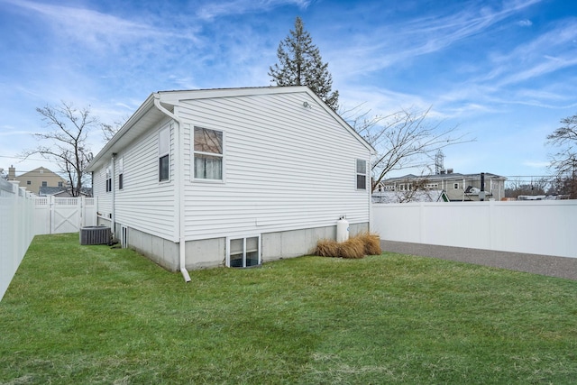 view of property exterior featuring cooling unit and a lawn