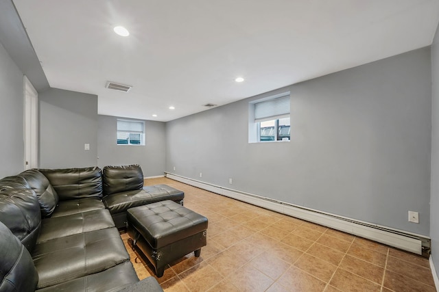 tiled living room featuring a baseboard radiator