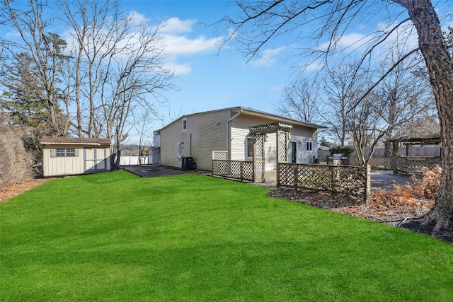 view of yard with a shed, cooling unit, and a pergola