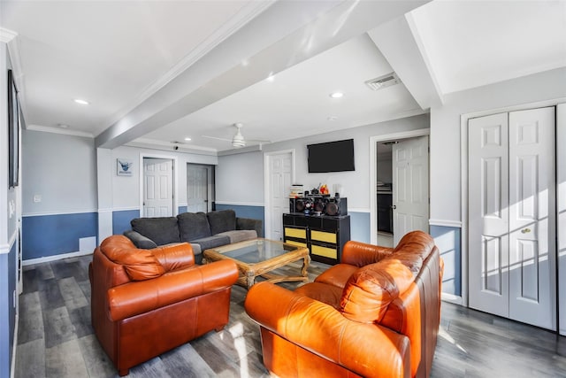 living room with dark hardwood / wood-style flooring and crown molding