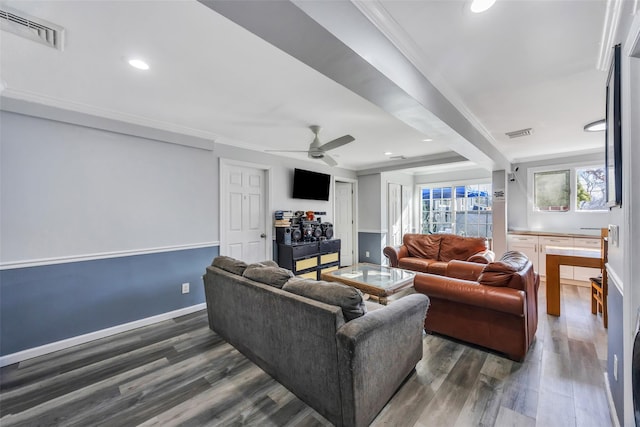 living room featuring crown molding, dark wood-type flooring, and ceiling fan