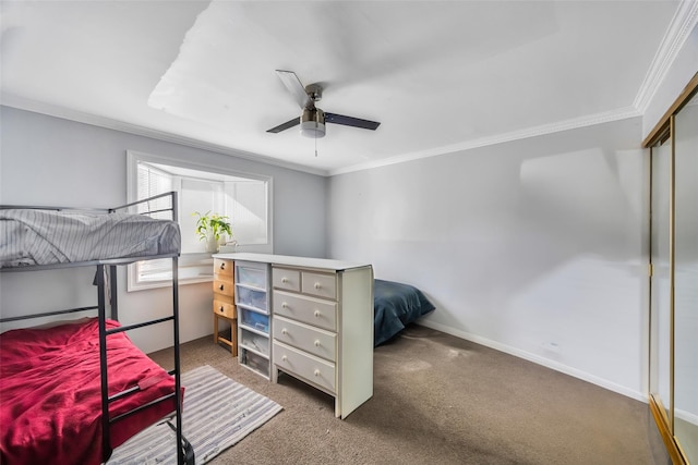 bedroom with crown molding, carpet floors, a closet, and ceiling fan