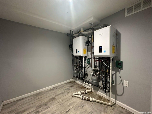 utility room with tankless water heater