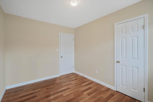 empty room featuring wood-type flooring