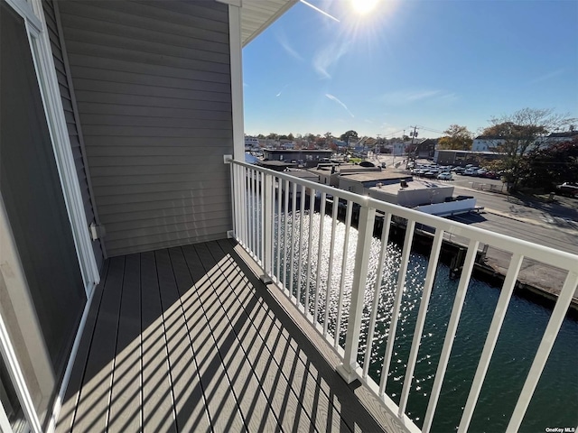 balcony featuring a water view