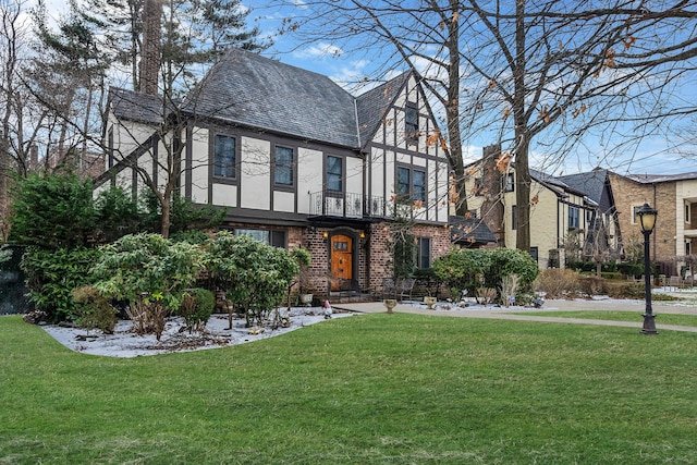 tudor house with a front yard