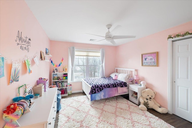 bedroom with hardwood / wood-style floors and ceiling fan