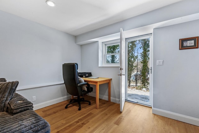 office space with light hardwood / wood-style flooring