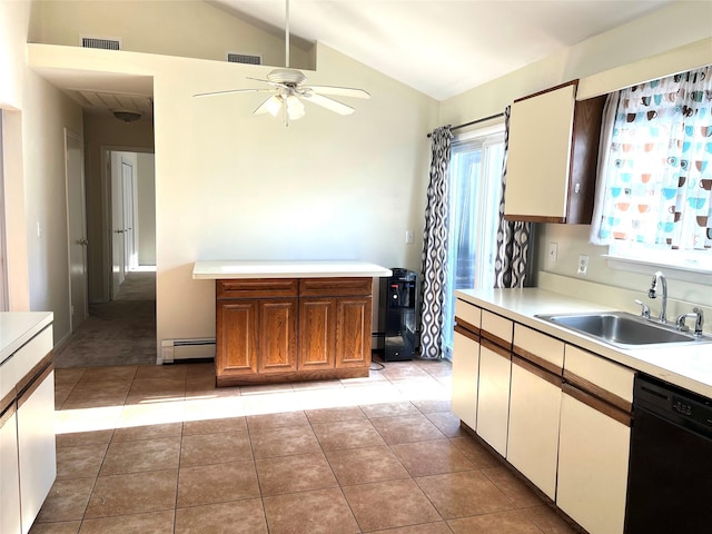 kitchen featuring lofted ceiling, sink, light tile patterned floors, baseboard heating, and dishwasher