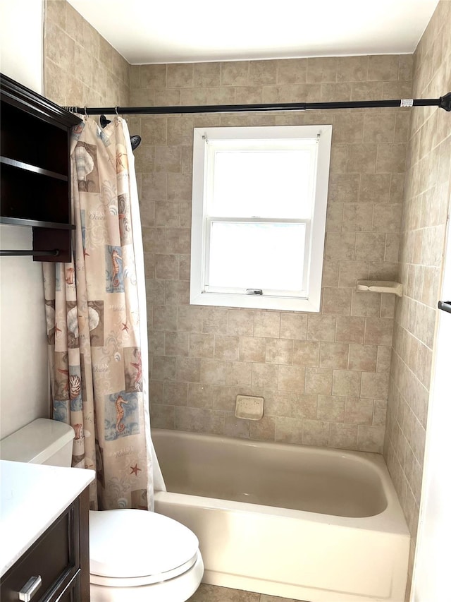 full bathroom with vanity, shower / tub combo with curtain, and toilet