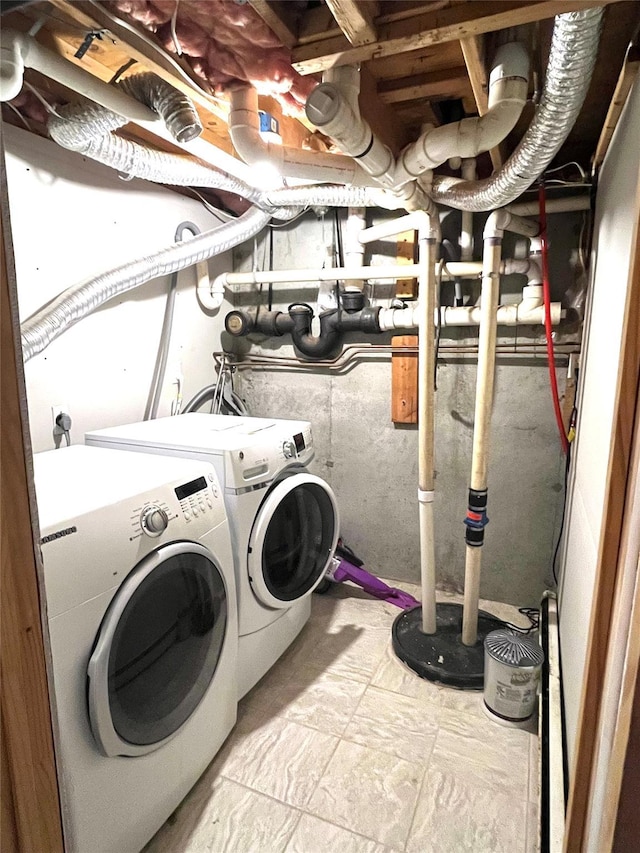 washroom featuring washer and dryer