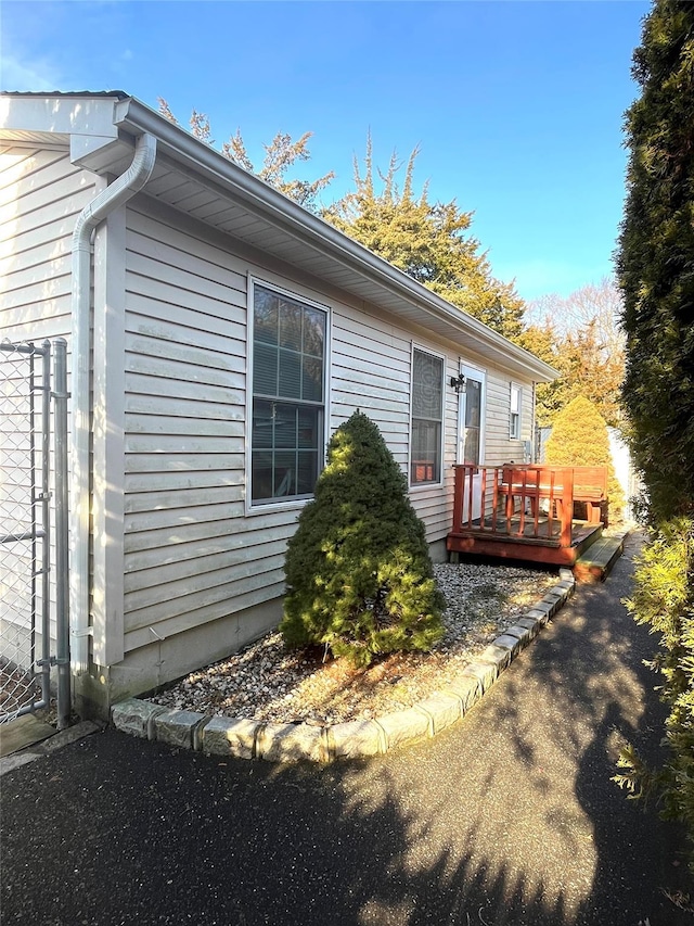 view of property exterior featuring a deck